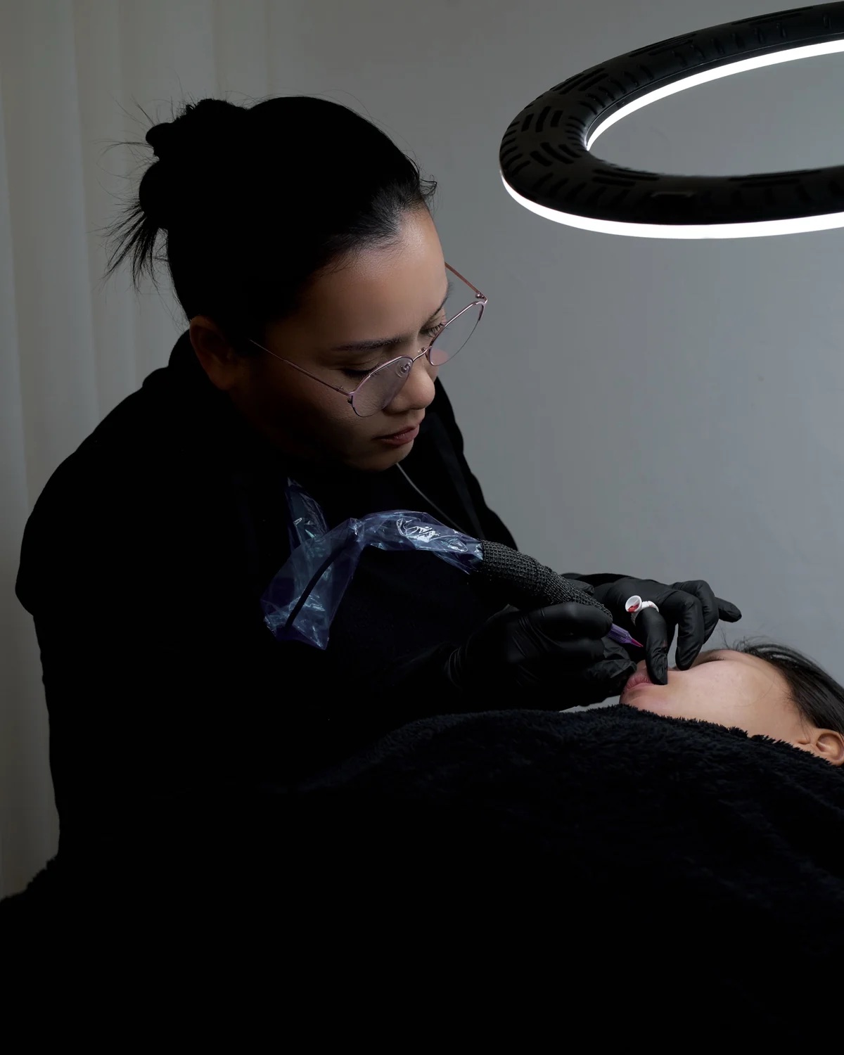 Hong Tuyen Nguyen at work under the ring light