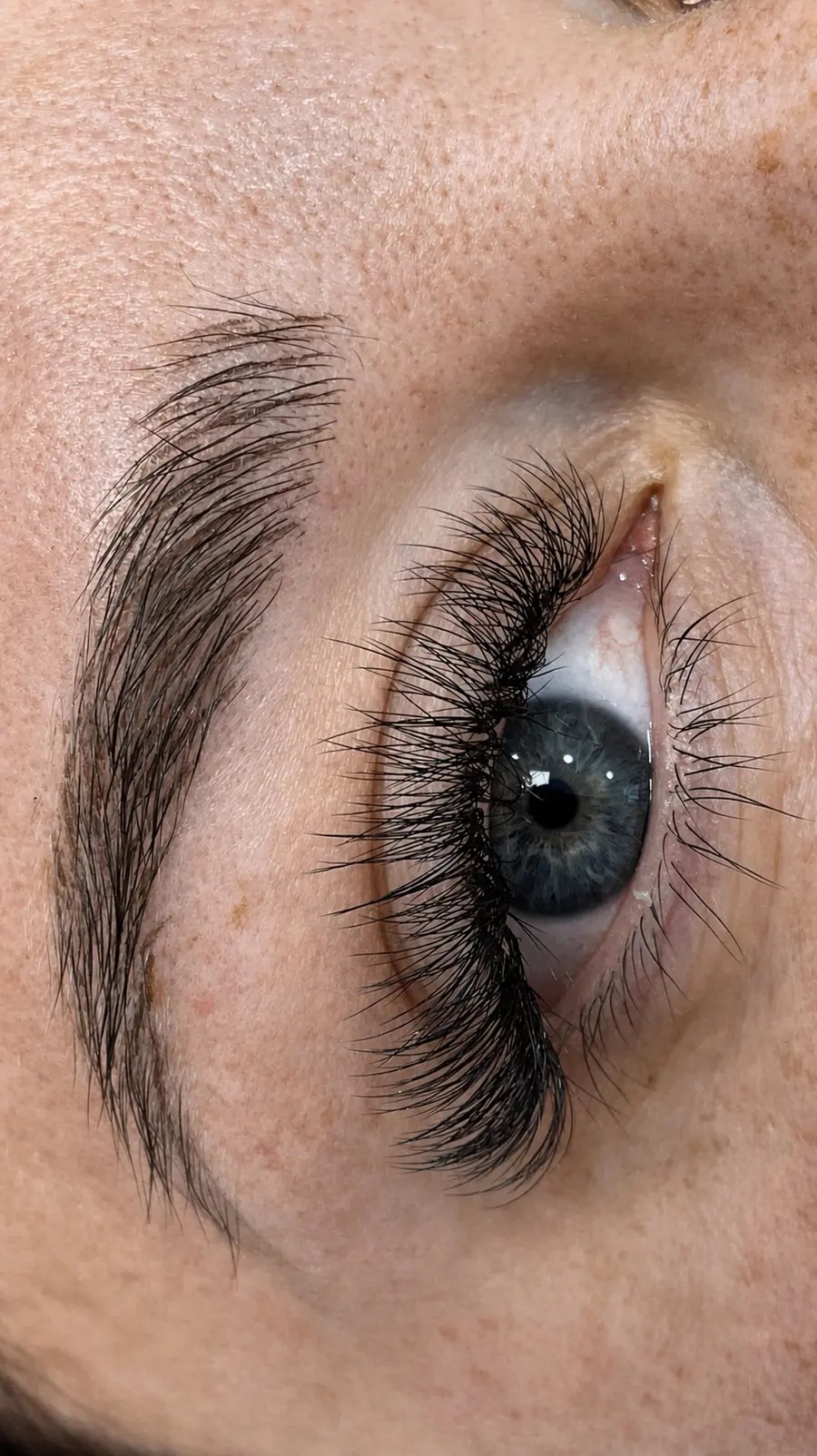 Volume lashes on a grey iris